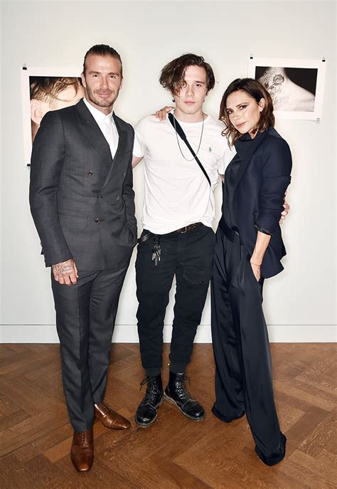 Victoria Beckham, David Beckham, Brooklyn Beckham backstage 